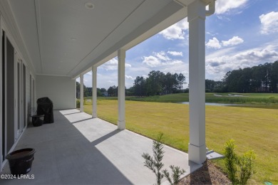 This nearly new ''Shoal'' with farmhouse elevation overlooks a on Hampton Pointe Golf Course in South Carolina - for sale on GolfHomes.com, golf home, golf lot