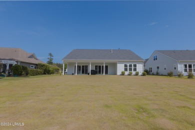 This nearly new ''Shoal'' with farmhouse elevation overlooks a on Hampton Pointe Golf Course in South Carolina - for sale on GolfHomes.com, golf home, golf lot