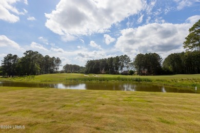 This nearly new ''Shoal'' with farmhouse elevation overlooks a on Hampton Pointe Golf Course in South Carolina - for sale on GolfHomes.com, golf home, golf lot