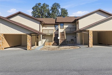 This Greenbriar upstairs unit offers a serene living experience on Citrus Hills Golf Club in Florida - for sale on GolfHomes.com, golf home, golf lot