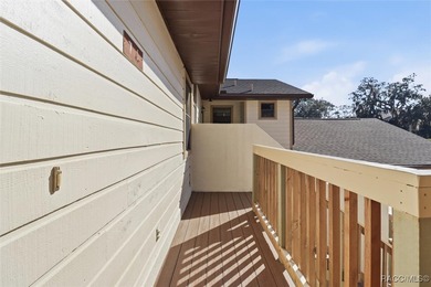 This Greenbriar upstairs unit offers a serene living experience on Citrus Hills Golf Club in Florida - for sale on GolfHomes.com, golf home, golf lot