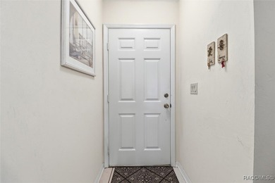 This Greenbriar upstairs unit offers a serene living experience on Citrus Hills Golf Club in Florida - for sale on GolfHomes.com, golf home, golf lot