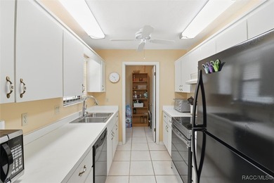 This Greenbriar upstairs unit offers a serene living experience on Citrus Hills Golf Club in Florida - for sale on GolfHomes.com, golf home, golf lot