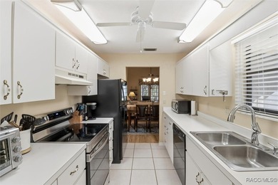 This Greenbriar upstairs unit offers a serene living experience on Citrus Hills Golf Club in Florida - for sale on GolfHomes.com, golf home, golf lot