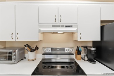 This Greenbriar upstairs unit offers a serene living experience on Citrus Hills Golf Club in Florida - for sale on GolfHomes.com, golf home, golf lot