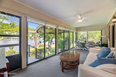 This Mediterranean-style brick home offers panoramic views of on Harbour Point Golf Club in North Carolina - for sale on GolfHomes.com, golf home, golf lot