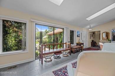 This Mediterranean-style brick home offers panoramic views of on Harbour Point Golf Club in North Carolina - for sale on GolfHomes.com, golf home, golf lot