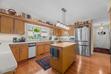 This Mediterranean-style brick home offers panoramic views of on Harbour Point Golf Club in North Carolina - for sale on GolfHomes.com, golf home, golf lot