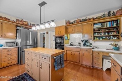 This Mediterranean-style brick home offers panoramic views of on Harbour Point Golf Club in North Carolina - for sale on GolfHomes.com, golf home, golf lot