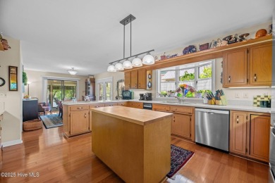 This Mediterranean-style brick home offers panoramic views of on Harbour Point Golf Club in North Carolina - for sale on GolfHomes.com, golf home, golf lot