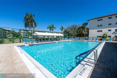 This is it! The most stunning unit in Wynmoor! Overlooking on Wynmoor Golf Course in Florida - for sale on GolfHomes.com, golf home, golf lot