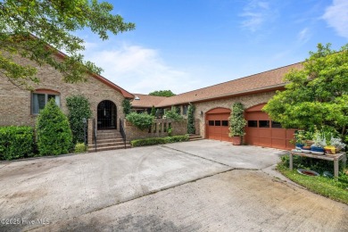 This Mediterranean-style brick home offers panoramic views of on Harbour Point Golf Club in North Carolina - for sale on GolfHomes.com, golf home, golf lot