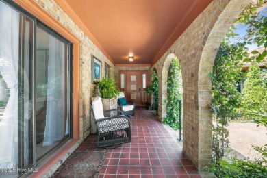 This Mediterranean-style brick home offers panoramic views of on Harbour Point Golf Club in North Carolina - for sale on GolfHomes.com, golf home, golf lot