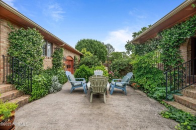 This Mediterranean-style brick home offers panoramic views of on Harbour Point Golf Club in North Carolina - for sale on GolfHomes.com, golf home, golf lot