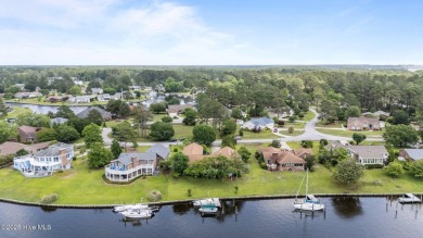 This Mediterranean-style brick home offers panoramic views of on Harbour Point Golf Club in North Carolina - for sale on GolfHomes.com, golf home, golf lot