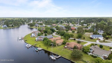 This Mediterranean-style brick home offers panoramic views of on Harbour Point Golf Club in North Carolina - for sale on GolfHomes.com, golf home, golf lot