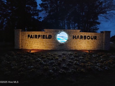 This Mediterranean-style brick home offers panoramic views of on Harbour Point Golf Club in North Carolina - for sale on GolfHomes.com, golf home, golf lot