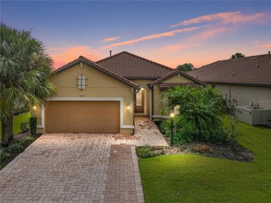 Stunning 3BR/3BA home on a pond located in the gated Esplanade on Esplanade Golf and Country at Lakewood Ranch in Florida - for sale on GolfHomes.com, golf home, golf lot