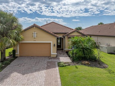 Stunning 3BR/3BA home on a pond located in the gated Esplanade on Esplanade Golf and Country at Lakewood Ranch in Florida - for sale on GolfHomes.com, golf home, golf lot