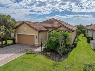 Stunning 3BR/3BA home on a pond located in the gated Esplanade on Esplanade Golf and Country at Lakewood Ranch in Florida - for sale on GolfHomes.com, golf home, golf lot