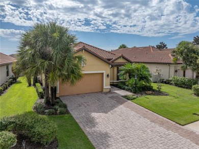 Stunning 3BR/3BA home on a pond located in the gated Esplanade on Esplanade Golf and Country at Lakewood Ranch in Florida - for sale on GolfHomes.com, golf home, golf lot