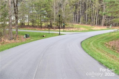 This Badin Lake waterfront lot is located in the prestigious on Old North State Club at Uwharrie Point Golf community in North Carolina - for sale on GolfHomes.com, golf home, golf lot