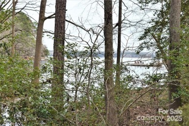 This Badin Lake waterfront lot is located in the prestigious on Old North State Club at Uwharrie Point Golf community in North Carolina - for sale on GolfHomes.com, golf home, golf lot