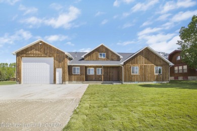 This stunning custom-built home sits on a generous lot right on on Star Valley RV Golf Course in Wyoming - for sale on GolfHomes.com, golf home, golf lot