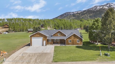 This stunning custom-built home sits on a generous lot right on on Star Valley RV Golf Course in Wyoming - for sale on GolfHomes.com, golf home, golf lot