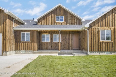This stunning custom-built home sits on a generous lot right on on Star Valley RV Golf Course in Wyoming - for sale on GolfHomes.com, golf home, golf lot
