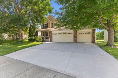Stunning 5-bed, 4-bath home with a 3-car garage in Blaine's on TPC of the Twin Cities in Minnesota - for sale on GolfHomes.com, golf home, golf lot