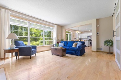 Stunning 5-bed, 4-bath home with a 3-car garage in Blaine's on TPC of the Twin Cities in Minnesota - for sale on GolfHomes.com, golf home, golf lot