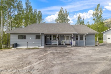 Discover mountain living at its finest with this stunning home on Star Valley RV Golf Course in Wyoming - for sale on GolfHomes.com, golf home, golf lot