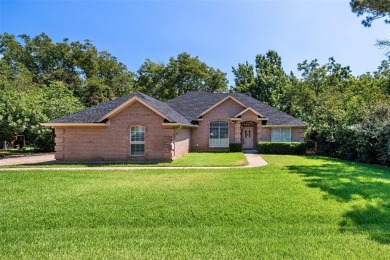 This comfortable 3-2.5-2 home with golf cart space is tucked on Nutcracker Golf Club in Texas - for sale on GolfHomes.com, golf home, golf lot