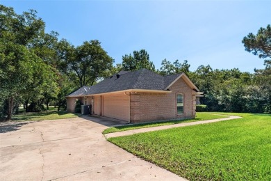 This comfortable 3-2.5-2 home with golf cart space is tucked on Nutcracker Golf Club in Texas - for sale on GolfHomes.com, golf home, golf lot