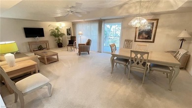 This second floor end-unit is a must see! It features a on The Glades Golf and Country Club in Florida - for sale on GolfHomes.com, golf home, golf lot