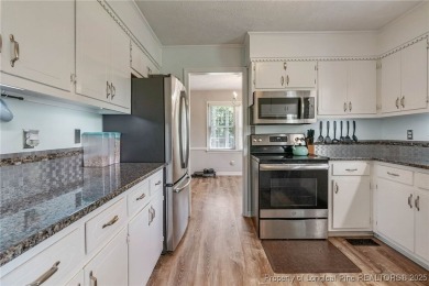 Welcome to this Gray's Creek tri-level cutie! On the main floor on Cypress Lakes Golf Course in North Carolina - for sale on GolfHomes.com, golf home, golf lot