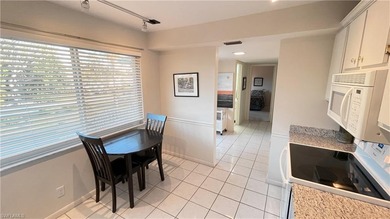 This second floor end-unit is a must see! It features a on The Glades Golf and Country Club in Florida - for sale on GolfHomes.com, golf home, golf lot
