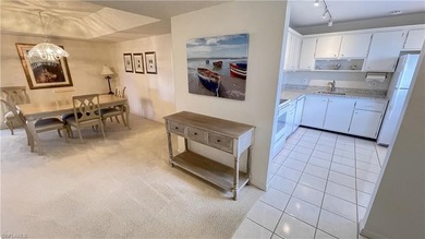 This second floor end-unit is a must see! It features a on The Glades Golf and Country Club in Florida - for sale on GolfHomes.com, golf home, golf lot