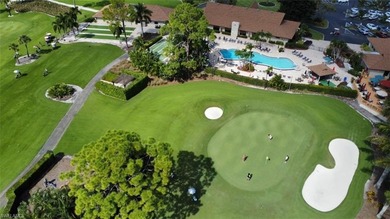 This second floor end-unit is a must see! It features a on The Glades Golf and Country Club in Florida - for sale on GolfHomes.com, golf home, golf lot