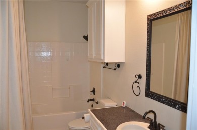 Terrific 3-Bedroom, 2-Bath Home with Pool and Outdoor Kitchen on Shady Oaks Golf Course in Texas - for sale on GolfHomes.com, golf home, golf lot