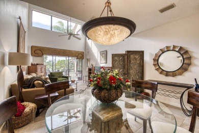 This charming 3-bedroom, 2.5-bathroom home with a tastefully on PGA National Golf Club in Florida - for sale on GolfHomes.com, golf home, golf lot