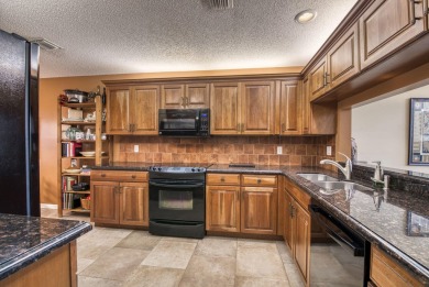 This charming 3-bedroom, 2.5-bathroom home with a tastefully on PGA National Golf Club in Florida - for sale on GolfHomes.com, golf home, golf lot