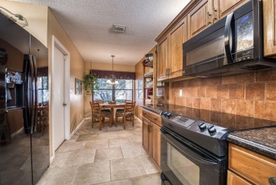 This charming 3-bedroom, 2.5-bathroom home with a tastefully on PGA National Golf Club in Florida - for sale on GolfHomes.com, golf home, golf lot