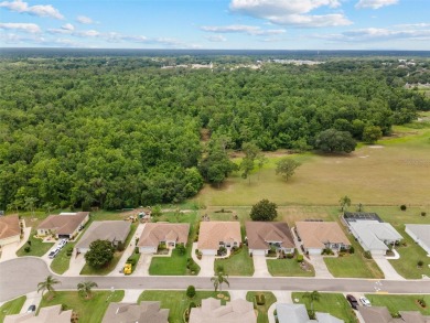 Discover this meticulously maintained 3-bedroom, 2-bathroom home on Huntington Hills Golf and Country Club in Florida - for sale on GolfHomes.com, golf home, golf lot