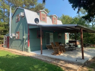 Outstanding view of a 80 plus acre private lake . Charming 3 bed on Clarksville Country Club in Texas - for sale on GolfHomes.com, golf home, golf lot