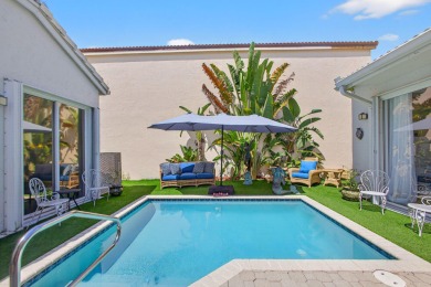 Rarely available single-story courtyard home perfectly situated on  in Florida - for sale on GolfHomes.com, golf home, golf lot