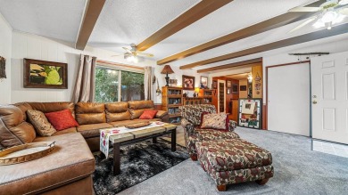 This Jewel of a home is ready to be yours! Artfully painted and on Lincoln Park Golf Course in Colorado - for sale on GolfHomes.com, golf home, golf lot