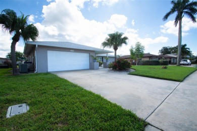 Desirable Pool Home in Deed Restricted Seminole Lake Golf on Seminole Lake Country Club in Florida - for sale on GolfHomes.com, golf home, golf lot