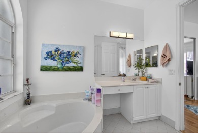 Rarely available single-story courtyard home perfectly situated on  in Florida - for sale on GolfHomes.com, golf home, golf lot